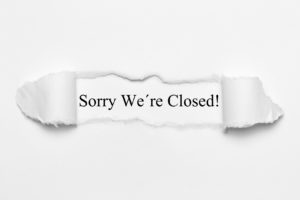 Sorry Were Closed! on white torn paper